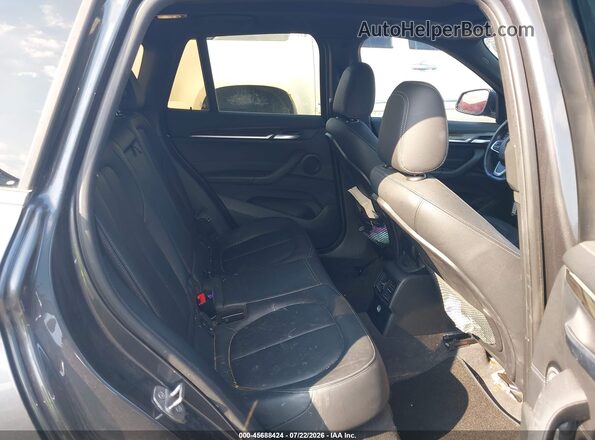 WBXHT3C30H5F73065 2017 BMW X1 Gray VIN sticker view