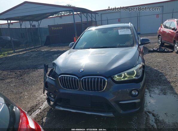 WBXHT3C30H5F73065 2017 BMW X1 Gray Rear interior view