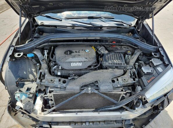 WBXHT3C30H5F80579 2017 BMW X1 Black Вид підкапотного простору