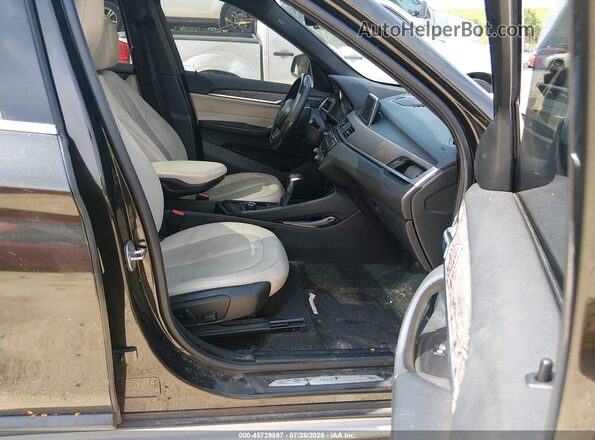 WBXHT3C31G5E55430 2016 BMW X1 Black წინა სალონის ხედი