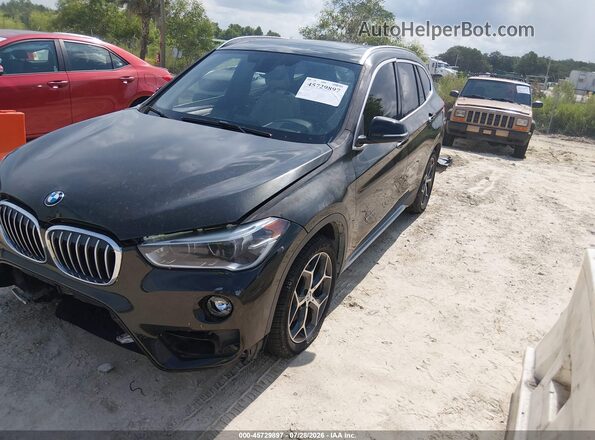 WBXHT3C31G5E55430 2016 BMW X1 Black წინა მარცხენა ხედი სამი მეოთხედიდან
