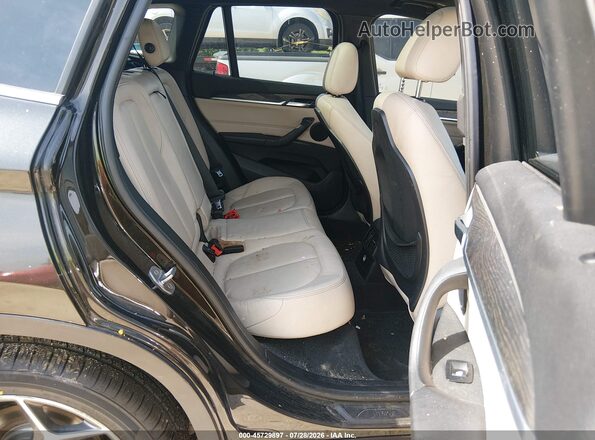 WBXHT3C31G5E55430 2016 BMW X1 Black VIN კოდის სტიკერის ხედი