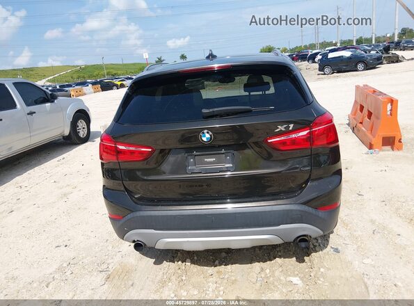 WBXHT3C31G5E55430 2016 BMW X1 Black 