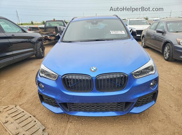 WBXHT3C31G5E56349 2016 BMW X1 Blue Vista frontal