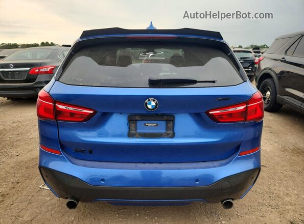 WBXHT3C31G5E56349 2016 BMW X1 Blue Vista trasera