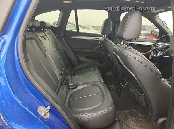 WBXHT3C31G5E56349 2016 BMW X1 Blue Vista de los asientos traseros