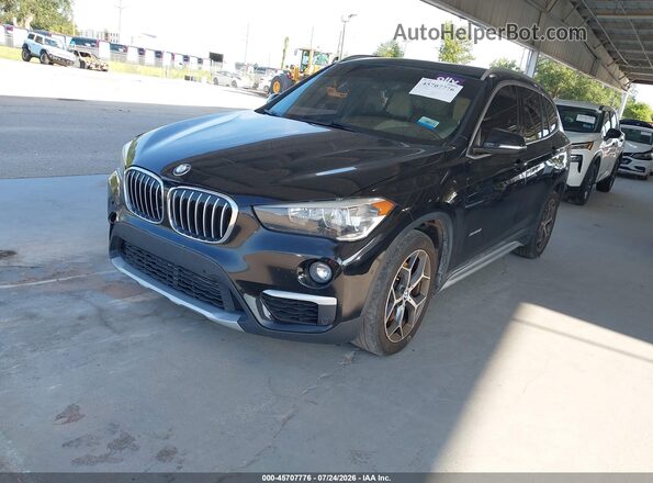 WBXHT3C31G5F64289 2016 BMW X1 Black Առջևի ձախ երեք քառորդ տեսարան
