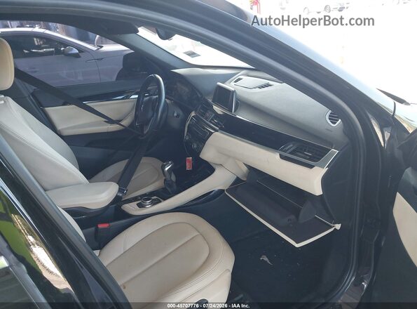 WBXHT3C31G5F64289 2016 BMW X1 Black Սալոնի դիմացի տեսք