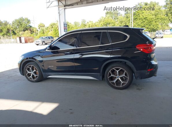 WBXHT3C31G5F64289 2016 BMW X1 Black Սալոնի 360 աստիճան տեսք