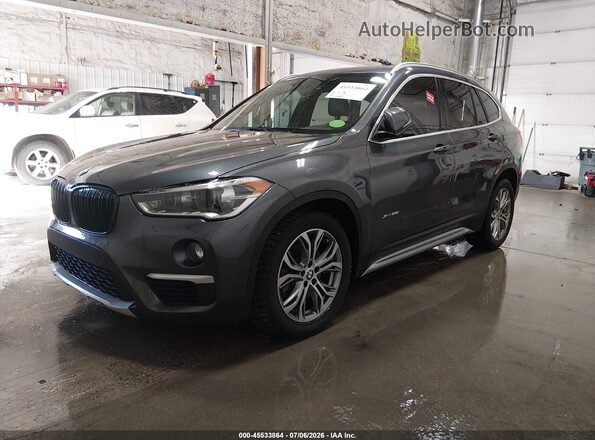WBXHT3C31H5F74063 2017 BMW X1 Black Vista tres cuartos delantera izquierda