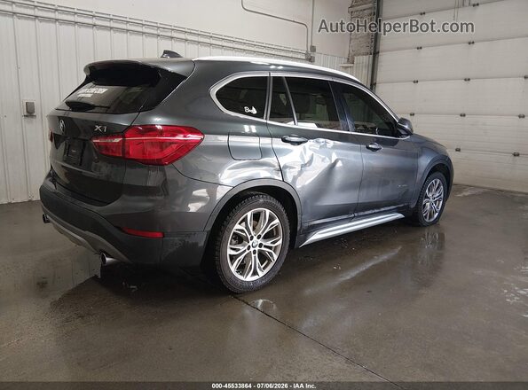 WBXHT3C31H5F74063 2017 BMW X1 Black Trasero derecho