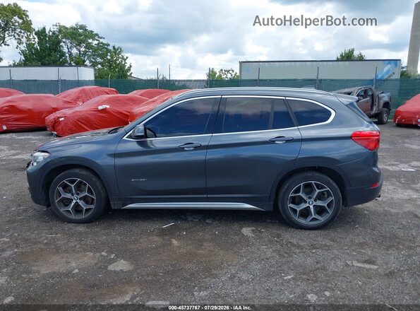 WBXHT3C31H5F78517 2017 BMW X1 Gray უკანა სალონის ხედი