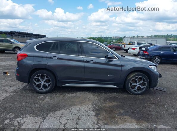 WBXHT3C31H5F78517 2017 BMW X1 Gray ხელსაწყოთა პანელის ხედი
