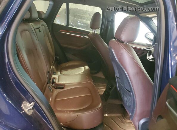 WBXHT3C32GP883105 2016 BMW X1 Blue Vista interior trasera