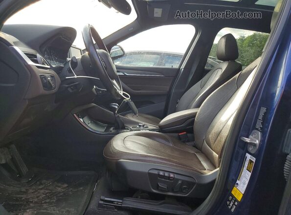 WBXHT3C32GP883105 2016 BMW X1 Blue Vista interior delantera