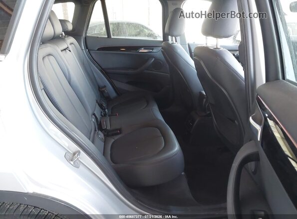 WBXHT3C32H5F68434 2017 BMW X1 Silver VIN sticker view