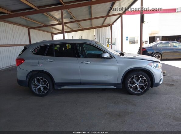 WBXHT3C32H5F68434 2017 BMW X1 Silver Rear interior view
