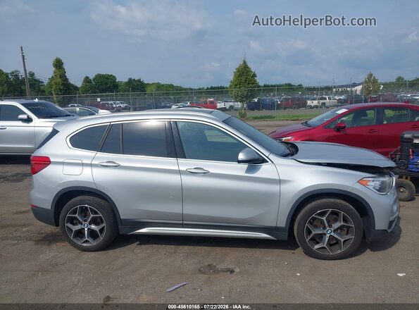 WBXHT3C32J3H32864 2018 BMW X1 Silver Вид задньої частини салону