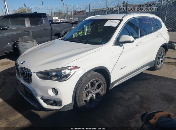 WBXHT3C33G5E49967 2016 BMW X1 White Առջևի ձախ երեք քառորդ տեսարան