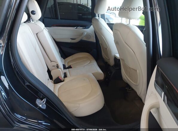 WBXHT3C33G5E50164 2016 BMW X1 Black VIN კოდის სტიკერის ხედი