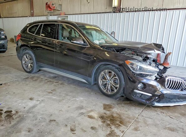 WBXHT3C33G5F65833 2016 BMW X1 Черный Передняя правая четверть