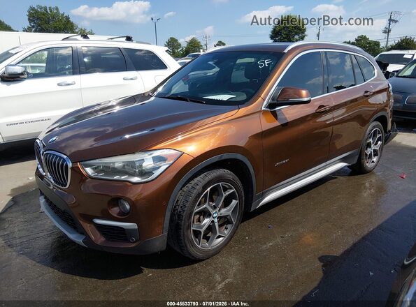 WBXHT3C33H5F72606 2017 BMW X1 Brown წინა მარცხენა ხედი სამი მეოთხედიდან