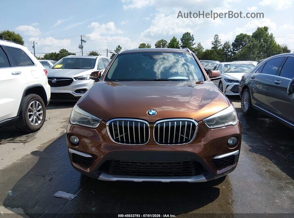WBXHT3C33H5F72606 2017 BMW X1 Brown ხელსაწყოთა პანელის ხედი