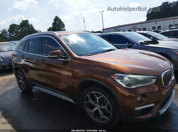 WBXHT3C33H5F72606 2017 BMW X1 Brown უკანა სალონის ხედი