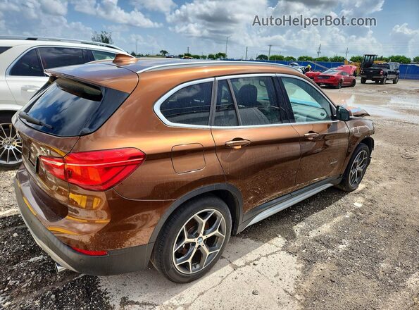 WBXHT3C33H5F82651 2017 BMW X1 Коричневый Задняя правая четверть
