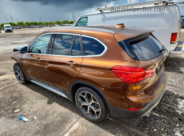 WBXHT3C33H5F82651 2017 BMW X1 Коричневый Задняя левая четверть
