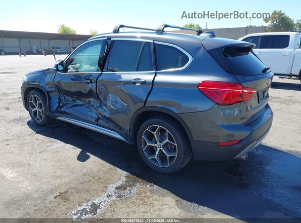 WBXHT3C33J5F91906 2018 BMW X1 Gray Trasero izquierdo