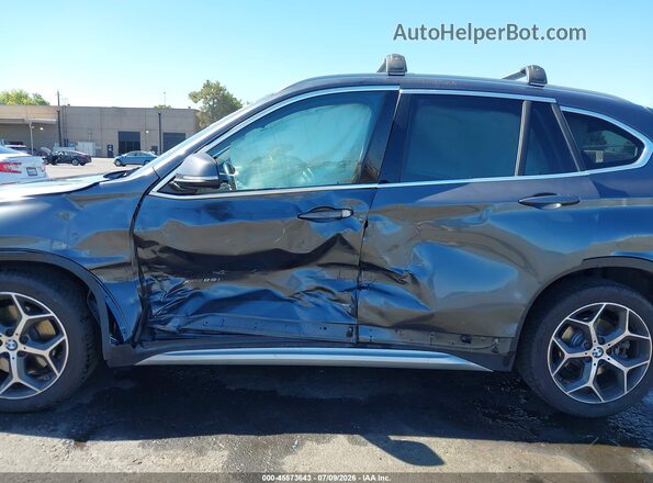 WBXHT3C33J5F91906 2018 BMW X1 Gray Vista frontal