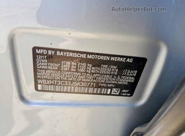 WBXHT3C33J5K30771 2018 BMW X1 Silver VIN sticker view