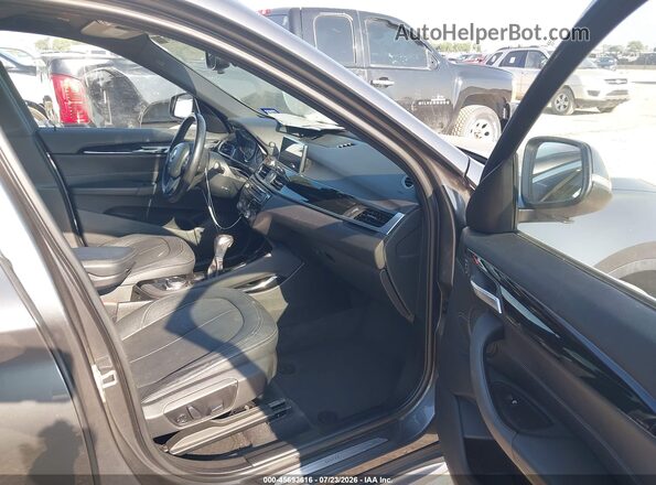 WBXHT3C34GP887849 2016 BMW X1 Black Front interior view