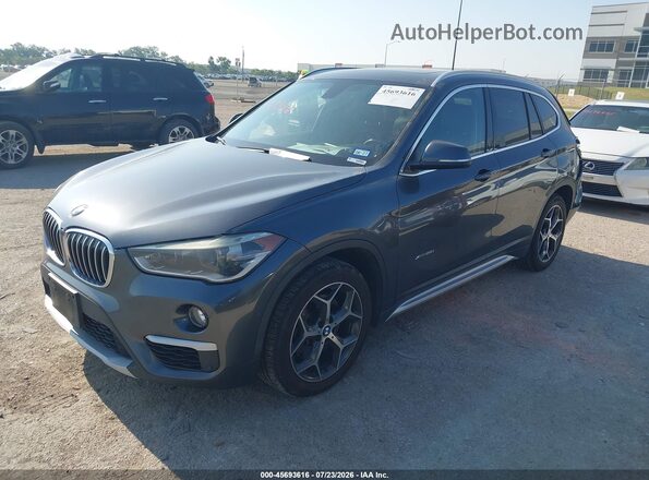 WBXHT3C34GP887849 2016 BMW X1 Black Front left