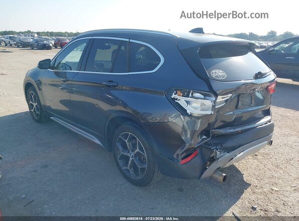 WBXHT3C34GP887849 2016 BMW X1 Black Rear left
