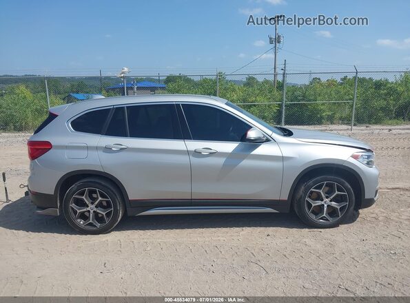 WBXHT3C34J5L32919 2018 BMW X1 Silver Rear interior view