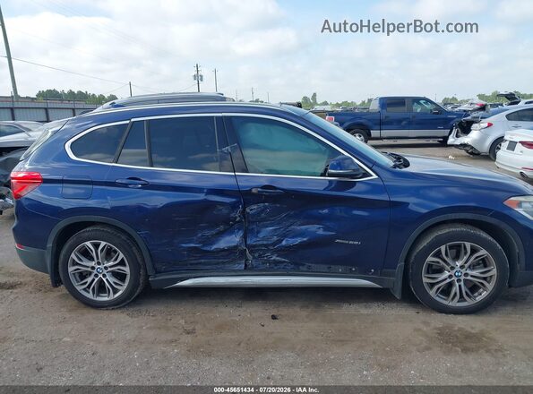 WBXHT3C35G5E51378 2016 BMW X1 Blue Вид задньої частини салону