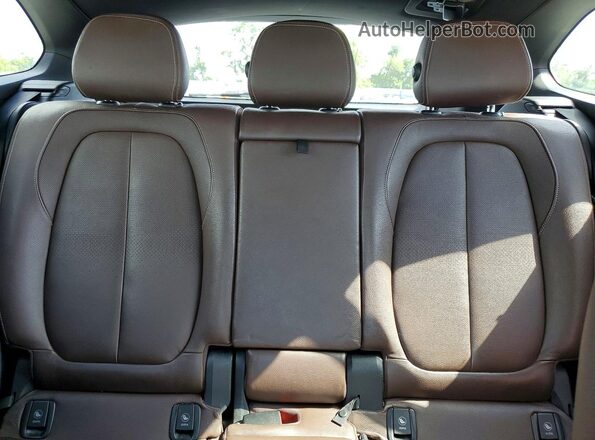 WBXHT3C36GP885519 2016 BMW X1 Tan Rear seats view