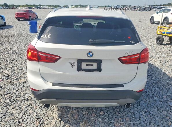 WBXHT3C36H5F73989 2017 BMW X1 White Rear view