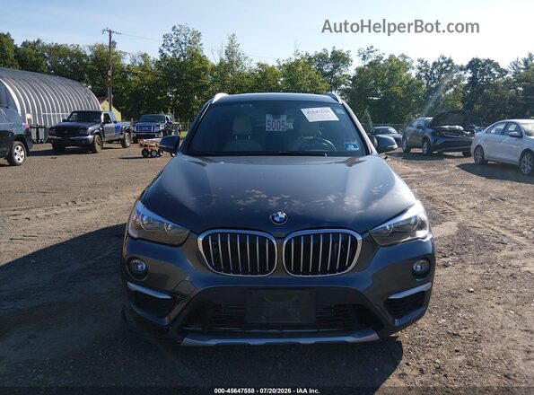WBXHT3C36J5L34705 2018 BMW X1 Gray Widok wnętrza z tyłu