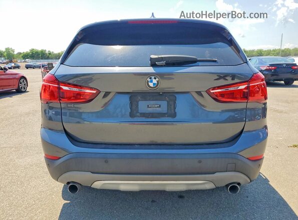 WBXHT3C37G5F64099 2016 BMW X1 Gray Vista trasera