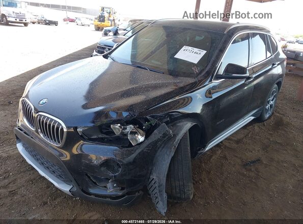 WBXHT3C37GP886419 2016 BMW X1 Black Front view