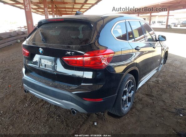 WBXHT3C37GP886419 2016 BMW X1 Black Rear right