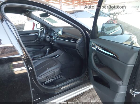 WBXHT3C37GP886419 2016 BMW X1 Black Front interior view