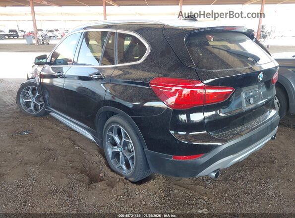 WBXHT3C37GP886419 2016 BMW X1 Black Rear left