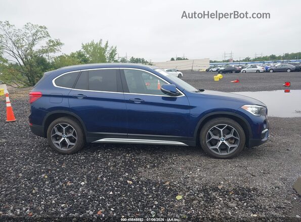 WBXHT3C37J5L33725 2018 BMW X1 Синий Вид задней части салона