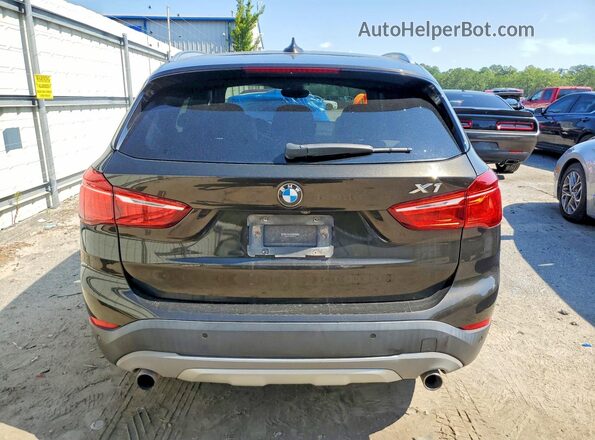 WBXHT3C38G5E51262 2016 BMW X1 Black Rear view