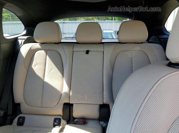 WBXHT3C38G5E51262 2016 BMW X1 Black Rear seats view