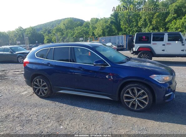 WBXHT3C38J3H30584 2018 BMW X1 Blue Вид задньої частини салону
